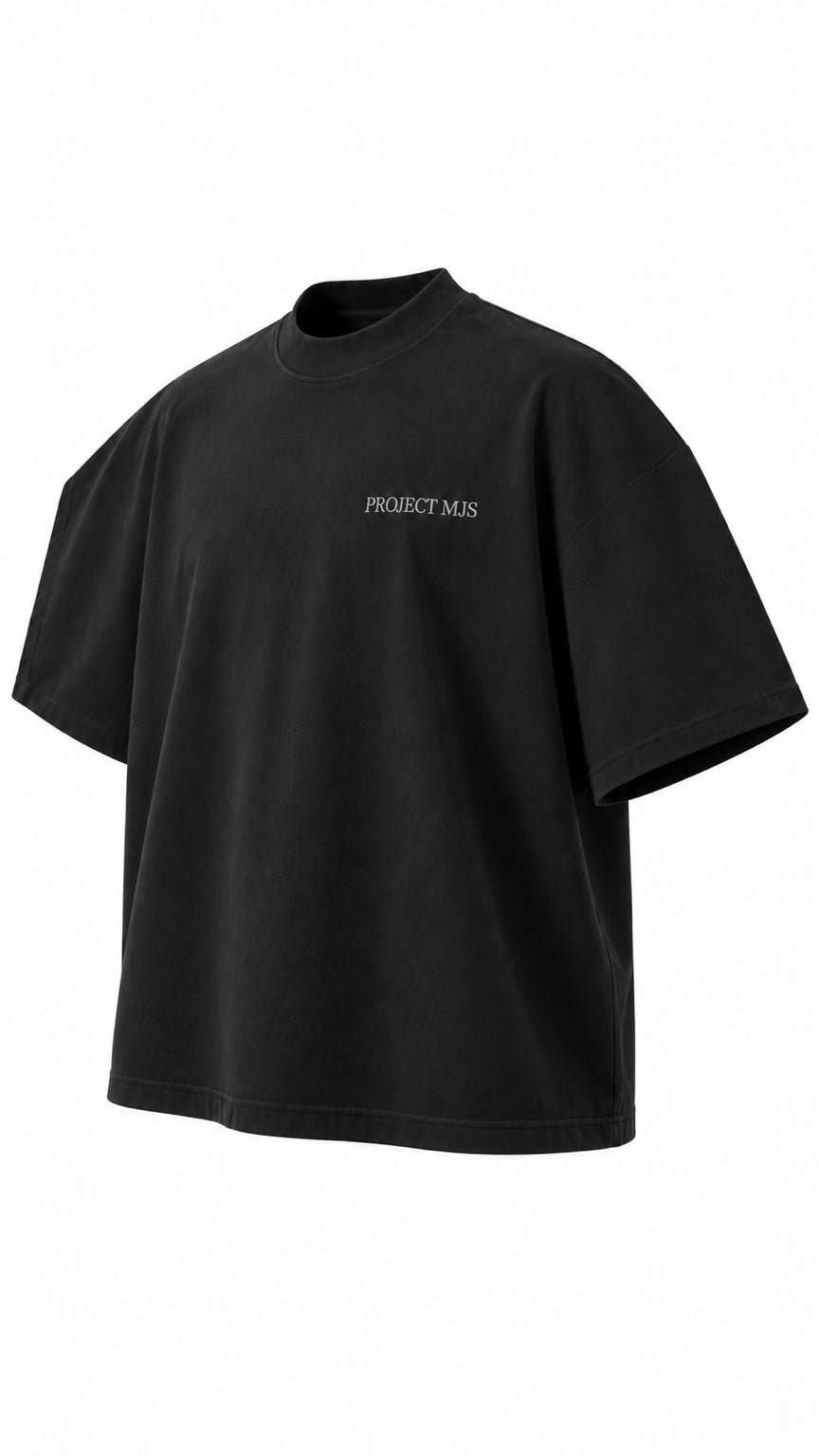 Project MJS black oversized statement tee, alternate front three-quarter angle