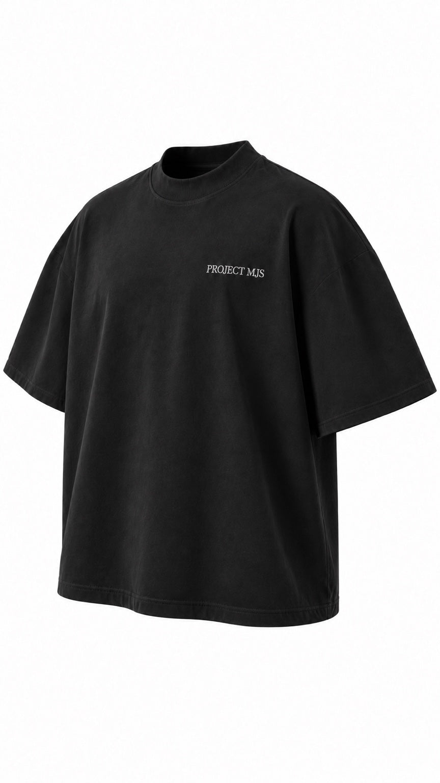 Project MJS black oversized statement tee, front three-quarter angle